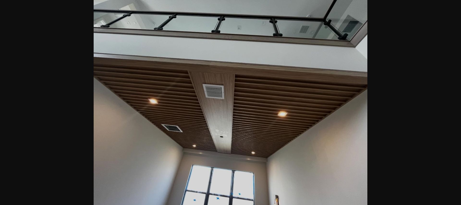 Slatted wood ceiling and integrated lighting by Marc's Custom Designs
