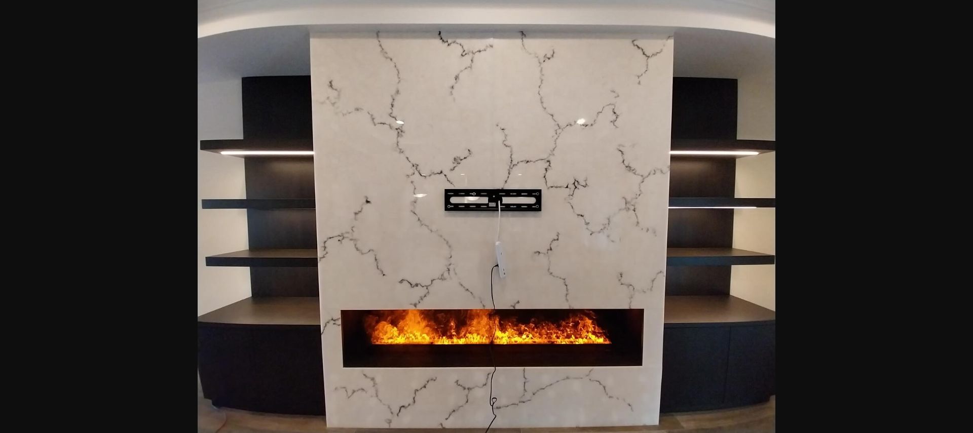 Stone fireplace media wall by Marc's Custom Designs